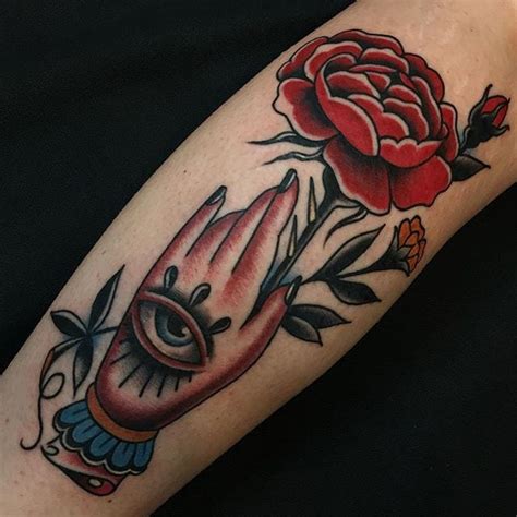 tattoo uploaded by stacie mayer hand holding a rose by travis costello traditional