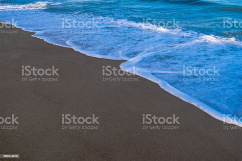 Soft Wave Of Blue Ocean On Sandy Beach Background Stock Photo