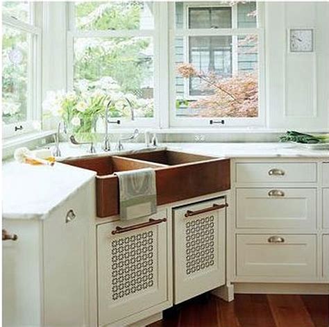 This makes the corner of the kitchen the perfect nook for a sink. corner sink cabinet size | Kitchens | Pinterest