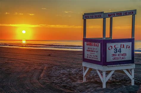 The Sunrise On The Beach Ocean City New Jersey Photograph By Bill