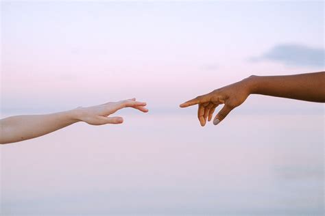 Photo Of People Reaching Each Others Hands · Free Stock Photo