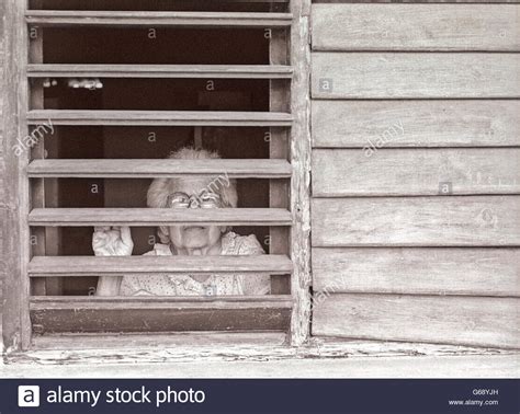 Nosey Woman Window Stock Photos And Nosey Woman Window Stock Images Alamy
