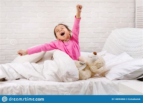 Little Child Girl Wakes Up From Sleep Stock Photo Image Of Hair