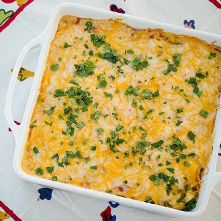 Spread 1/2 the shredded cheese blend over the first creamy chicken layer. Cheesy Chicken Dorito Casserole | Real Mom Kitchen