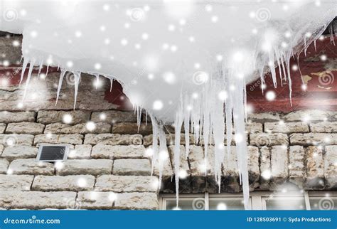 Icicles And Snow Hanging From Building Roof Stock Image Image Of Cold