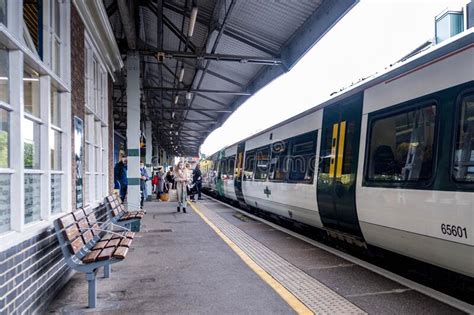 Passengers Boarding A Southern Rail Train At Epsom Station Editorial