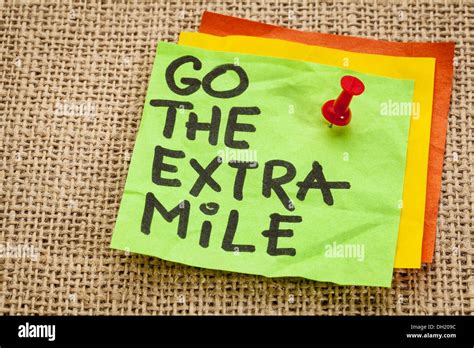 go the extra mile - motivational reminder - handwriting on sticky note