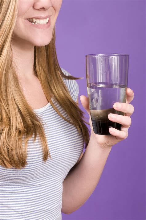 Water Free Stock Photo A Young Woman Holding A Glass Of Water 16089