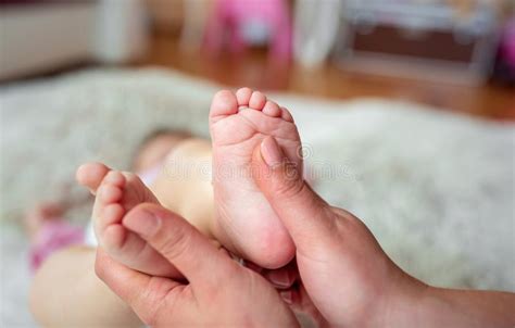 Newborn Baby Feet In Hands Of Mother Stock Photo Image Of Newborn