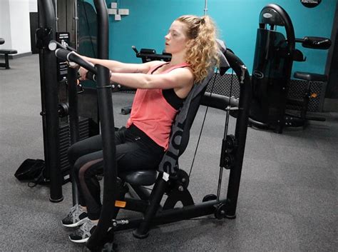 How To Use The Seated Tricep Dip Machine Exercise Tutorial
