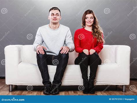 Shy Woman And Man Sitting On Sofa First Date Stock Photo Image Of