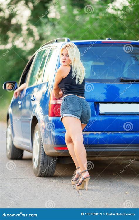 Pretty Blonde Girl On High Heels Pushing Broken Car Stock Image Image