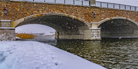 Snowy Trail Along Lake And Passing Under A Bridge Stock Image Image