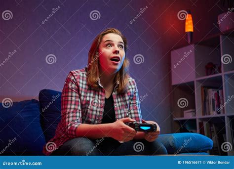 Portrait Of Crazy Playful Gamer Girl Enjoying Playing Video Games