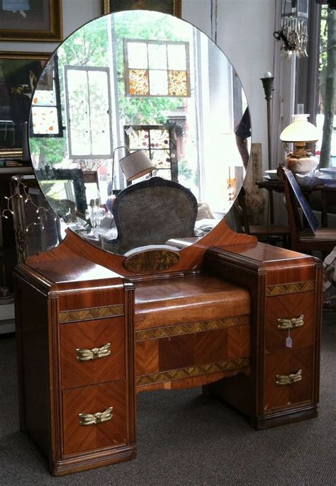 The bedroom vanity provides a place to store makeup, perfume and accessories. Antique Vanity Dresser With Round Mirror ~ BestDressers 2019