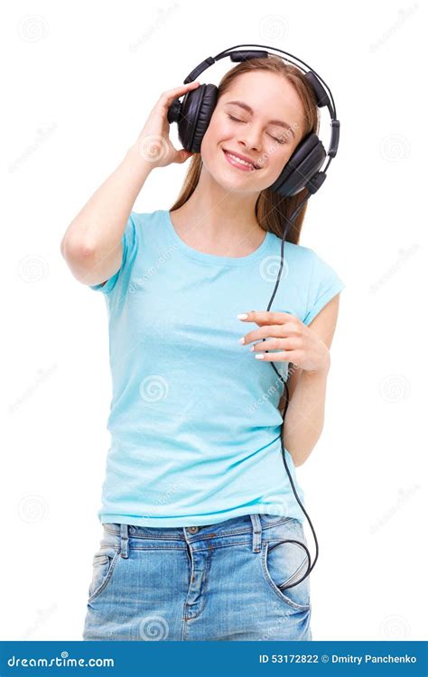 Young Woman With Headphones Listening To Music And Dancing Stock Photo