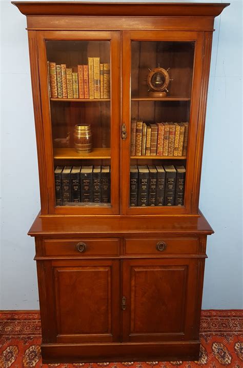 Only genuine antique two door bookcases approved for sale on www.sellingantiques.co.uk. Walnut Two Door Bookcase - Antiques Atlas