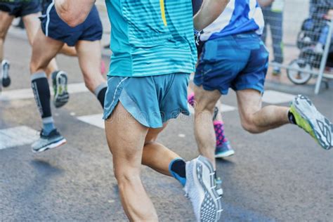 Marathon Race Feet Of People Running On City Road Stock Photo Image