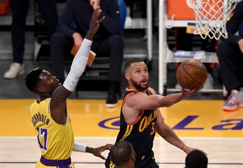 watch warriors stephen curry sinks insane buzzer beater against lakers in nba play in