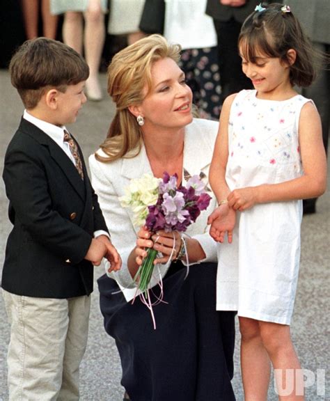 Queen Noor Of Jordan Talks With Two Children Making The Childrens