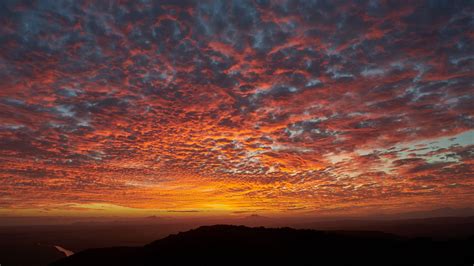 Download Wallpaper 2048x1152 Clouds Sky Fiery Sunset Ultrawide