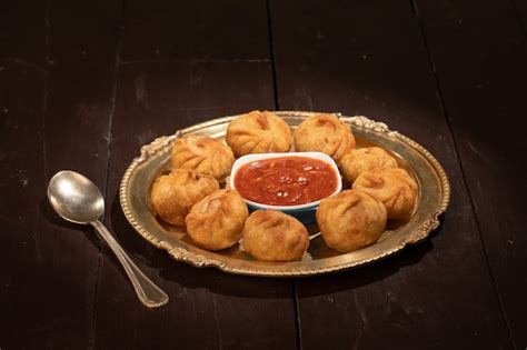Premium Photo Traditional Dumpling Momos Served With Sauce