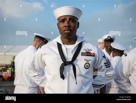 A Us Navy Sailor Stands At Parade Rest During A Uniform Inspection