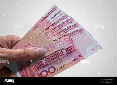 Hand Holding Chinese Renminbi Rmb Currency Of China Stock Photo Alamy