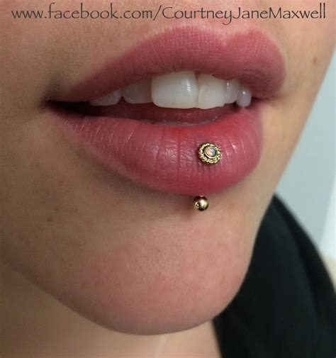 Healed Vertical Lip Piercing She Is Wearing A 14k Gold Choctaw End With White Opal And A