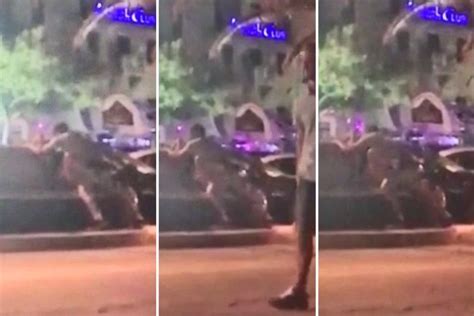 outrageous moment randy couple are caught having sex on a bench in the centre of a lively