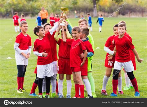 Kids Soccer Football Children Players Celebrating With A Trop Stock