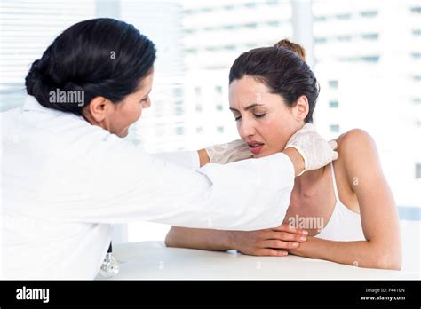 Doctor Examining Her Patients Neck Stock Photo Alamy