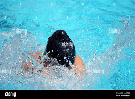 Closeup Shot Of A Swimmer Practicing In The Swimming Pool Stock Photo
