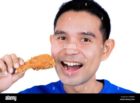 Young Man Eating Fried Chicken Stock Photo Alamy