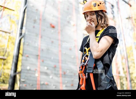 Portrait Of A Well Equipped Young Woman Feeling Scared Before Climbing