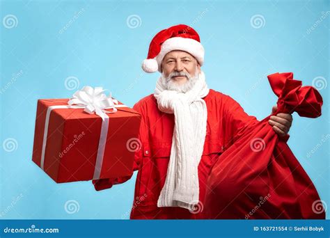 Happy Bearded Santa Claus With Red T Box And Big Sack Stock Photo