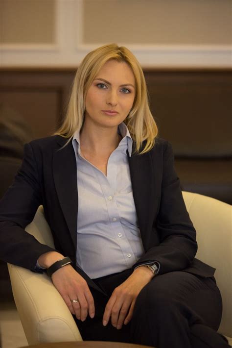Blonde Secretary In Black Suit And Teal Blouse Sitting Within Arm S Reach Of Her Boss In Case