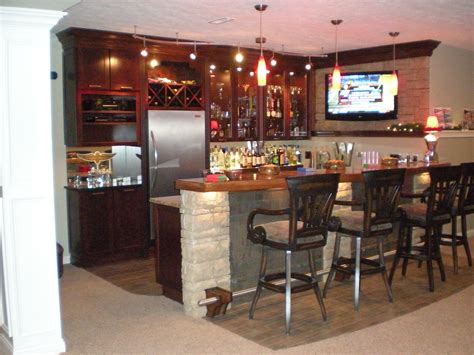 A Bar With Stools And A Television Mounted On The Wall