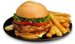 Blackened chicken, bacon, green leaf lettuce, tomato, ranch and american cheese on a toasted bun. blackened chicken salad zaxby's