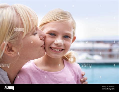 Girl Kissing Mothers Cheek On Hi Res Stock Photography And Images Alamy