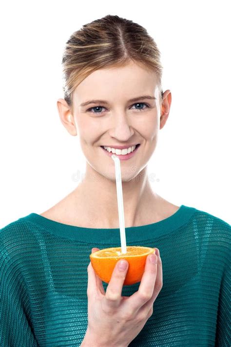 Girl Sipping Orange Juice Through Straw Stock Photos Image 31681813