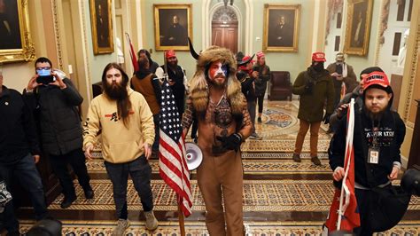 Jake Angeli Qanon Man In Fur Hat Horns During Capitol Riot Arrested
