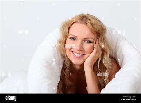 Portrait Of Beautiful Woman In Bed Under Blanket Stock Photo Alamy