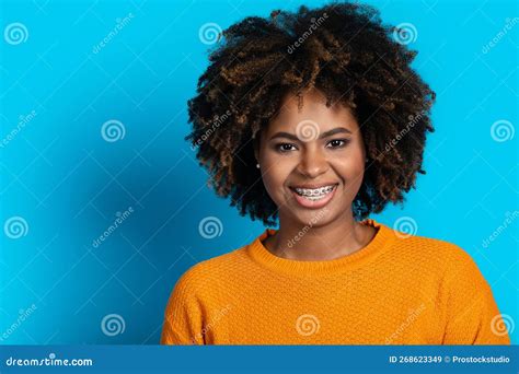 Portrait Of Attractive Smiling Black Woman Posing On Blue Stock Image