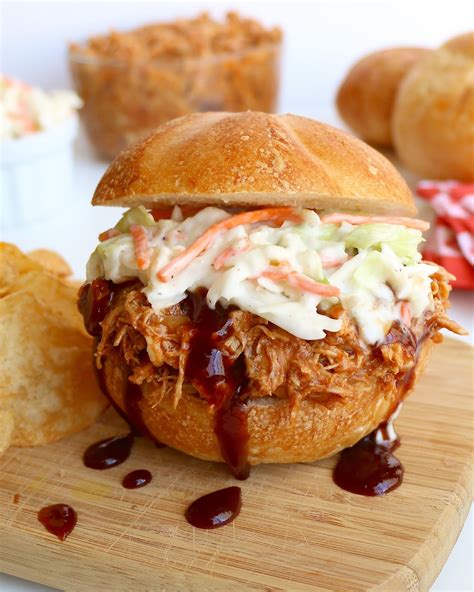 This recipe holds well in a crock pot / slow cooker so they are perfect for carry in dinners, graduation parties, etc. Shredded BBQ Chicken Sandwiches - The Lindsay Ann