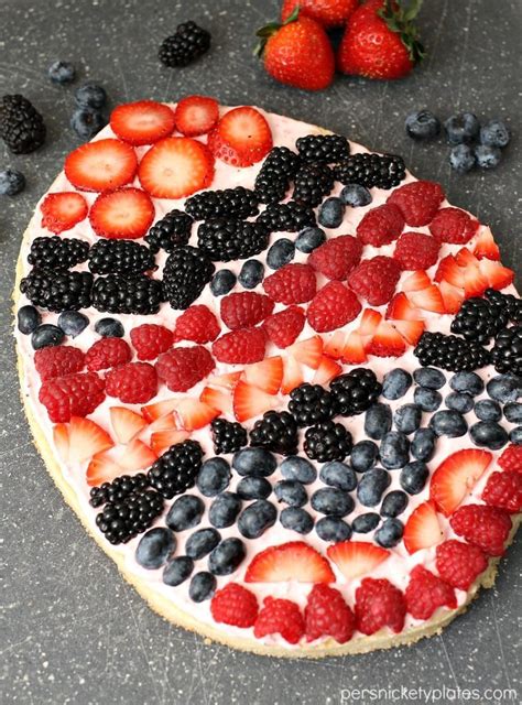 A Festive Easter Egg Sugar Cookie Fruit Pizza With Strawberry Cream