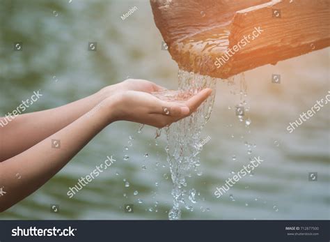 Water Pouring Womans Hand On Nature Stock Photo Edit Now 712877500