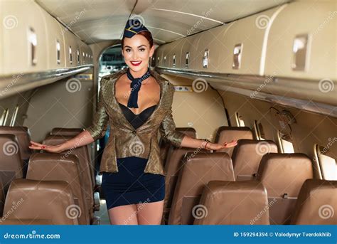 Portrait Of Smiling Flight Attendant Serving In Airplane Airplane And Woman Aviation And