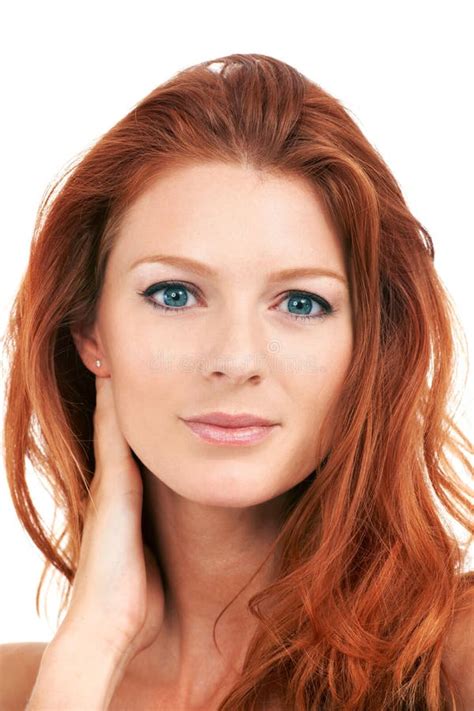 Flawless Beauty Closeup Of A Striking Red Head Gazing At The Camera Isolated On White Stock
