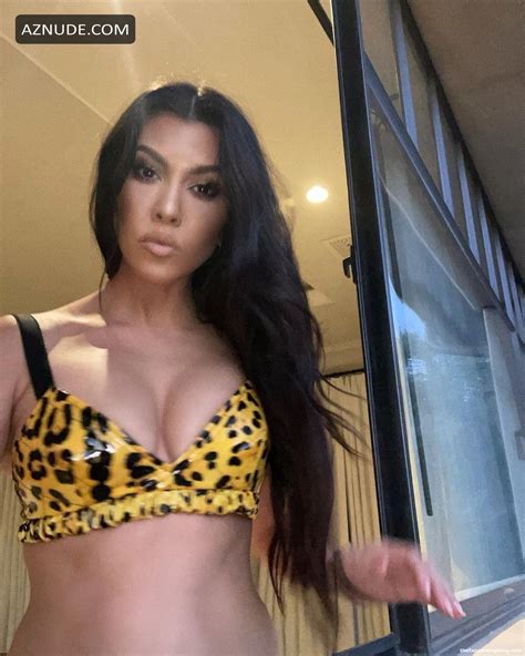 kourtney kardashian sexy flaunts her tits and shows off nice cleavage wearing a bikini aznude